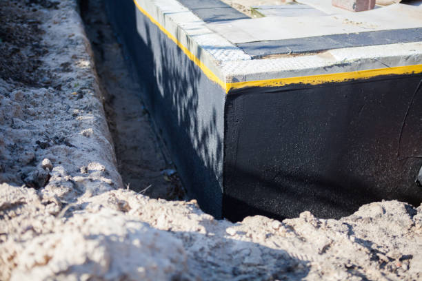 Professional Waterproofing technician working in Minotola, NJ